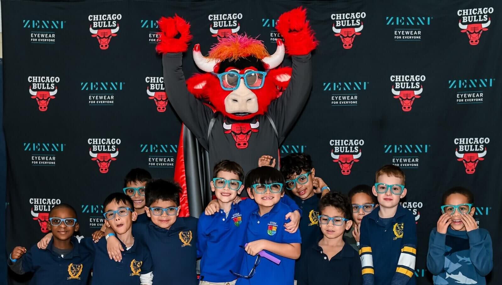 Group of children and Chicago Bulls mascot wearing Zenni eyewear. Background logos: "Chicago Bulls" and "Zenni Eyewear for Everyone."