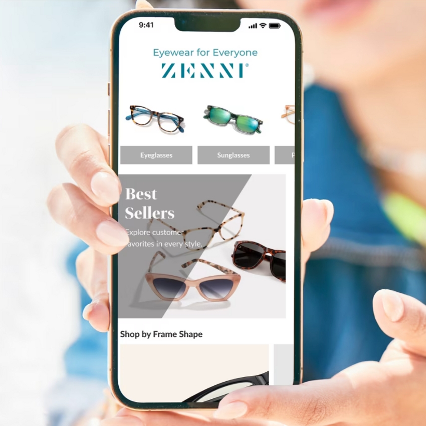 Mobile website displaying "Eyewear for Everyone ZENNI®." Sections include Eyeglasses, Sunglasses. Best Sellers - Explore customer favorites in every style. Shop by Frame Shape.