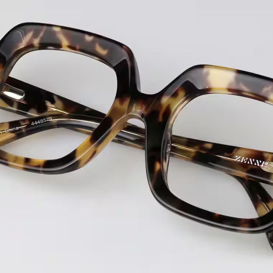 Tortoiseshell, square-shaped eyeglass frames with "ZENNI®" on the temple. Other engraving reads "China" and "4448525".